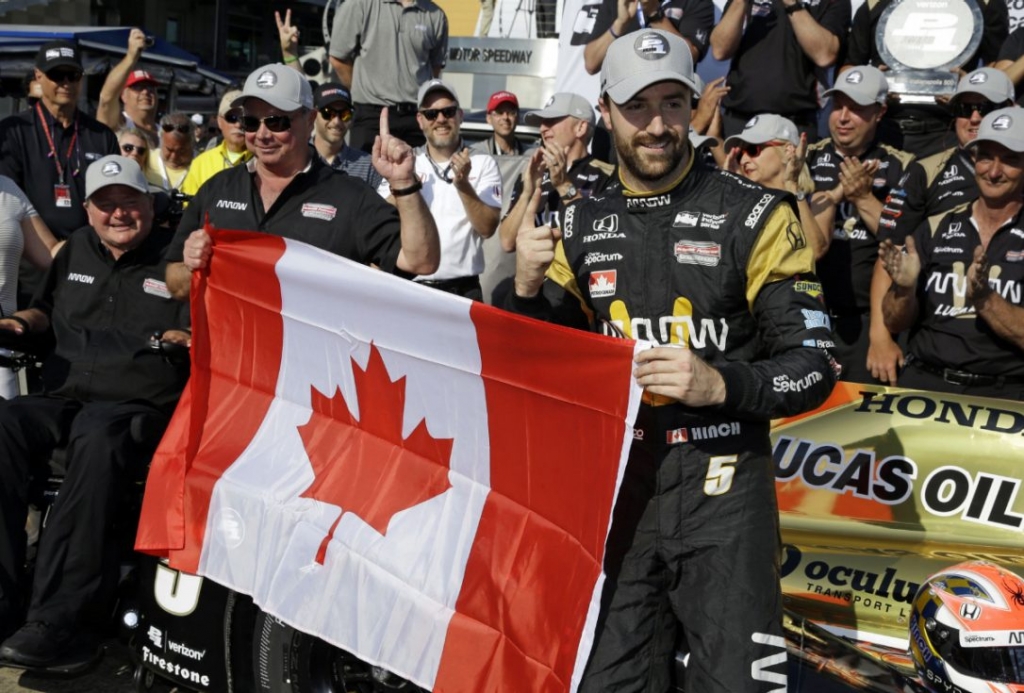 Oakville's James Hinchcliffe flies the flag after become just the second Canadian to win the Indy 500 pole