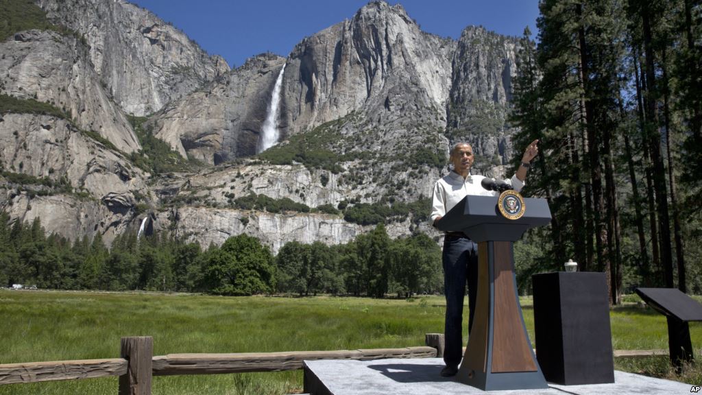 President Barack Obama speaks by the Sentinel Bridge in front of the Yosemite Falls the highest waterfall in Yosemite National Park Calif