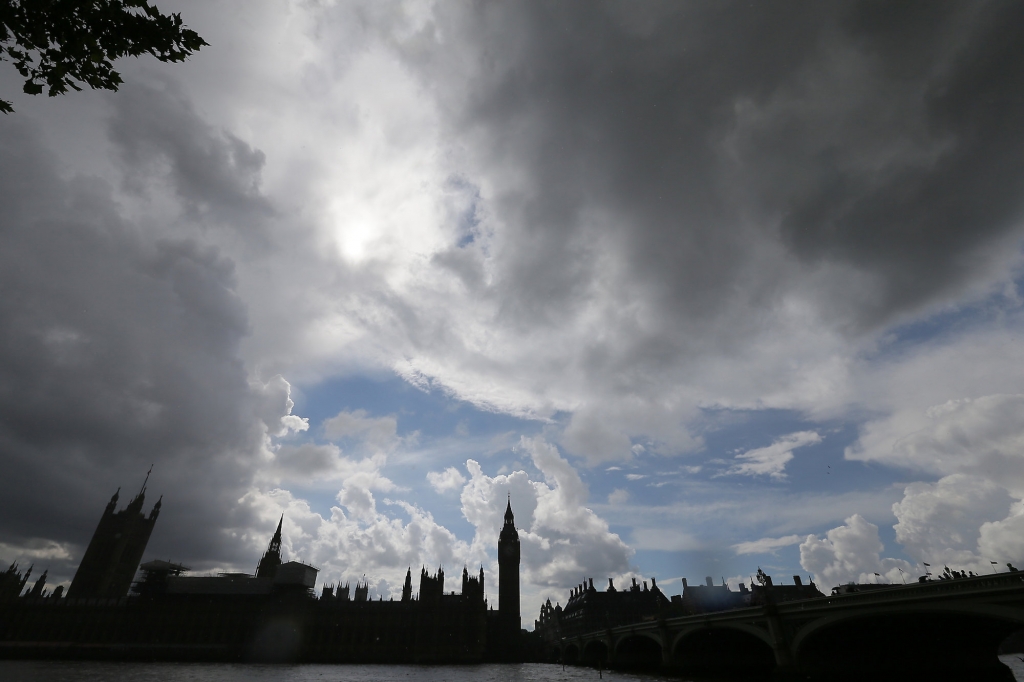 Clouds gather above the Houses of Parliament on the banks of the river Thames following yesterday's EU referendum result London Saturday