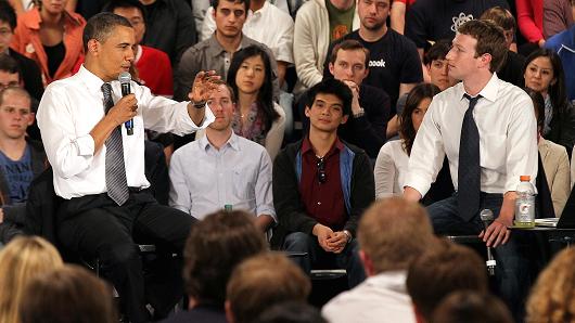 President Barack Obama talks with Facebook CEO Mark Zuckerberg