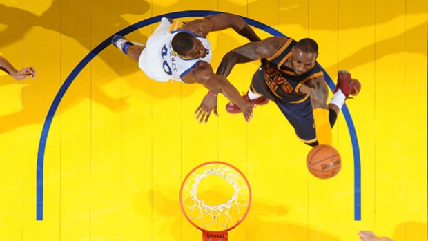 LeBron James right of the Cleveland Cavaliers goes to the basket against Harrison Barnes of the Golden State Warriors in Game 1 of the 2016 NBA Finals on June 2 Oakland Calif. The Cavaliers trail the Warriors 1-0. Game 2 is scheduled for Sunday