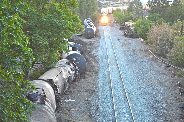 Environmental watchdog Columbia Riverkeeper says derailed train cars were still leaking when Union Pacific started moving cargo on rebuilt tracks this weekend