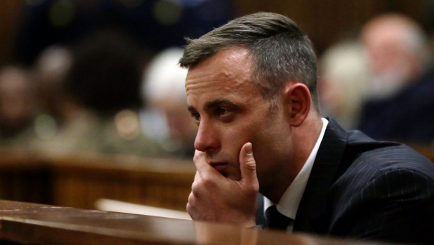 Oscar Pistorius sits in the dock during his sentencing