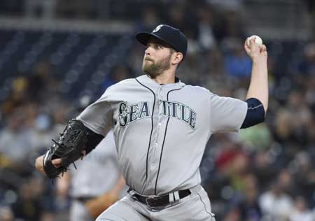 James Paxton No.65 of the Seattle Mariners pitches during the first inning of a baseball game against the San Diego Padres at PETCO Park on Thursday in San Diego California. AFP