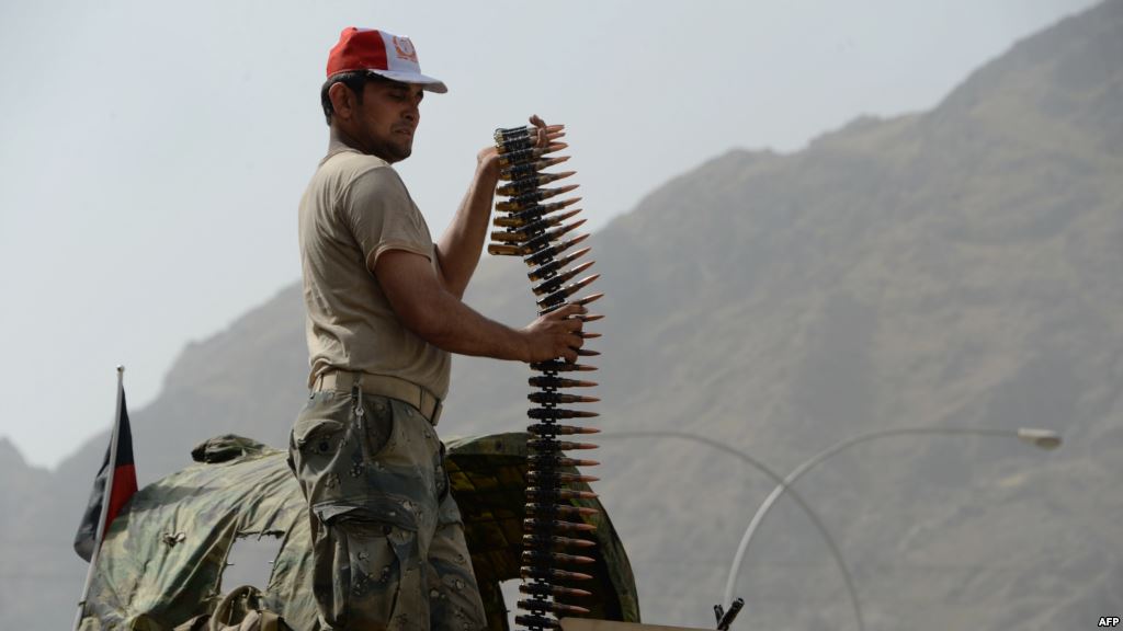 An Afghan border policeman takes position following clashes with Pakistani forces on the border between Afghanistan and Pakistan in eastern Nangarhar province