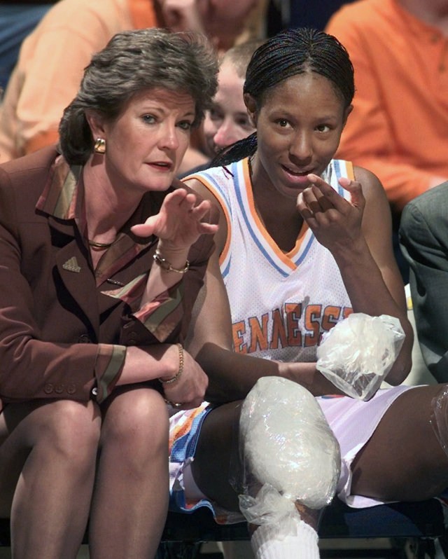 Tennessee head coach Pat Summitt talks with Chamique Holdsclaw on the bench as Holdsclaw ices her knees in the final minutes of their game against Florida at the SEC women's tournament in Chattanooga