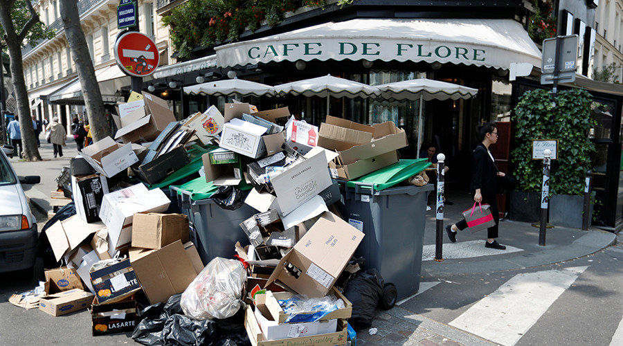 A pile of garbage bags is seen in front of the cafe in Paris during a strike of garbage collectors and sewer workers to protest the labour reforms law proposal France