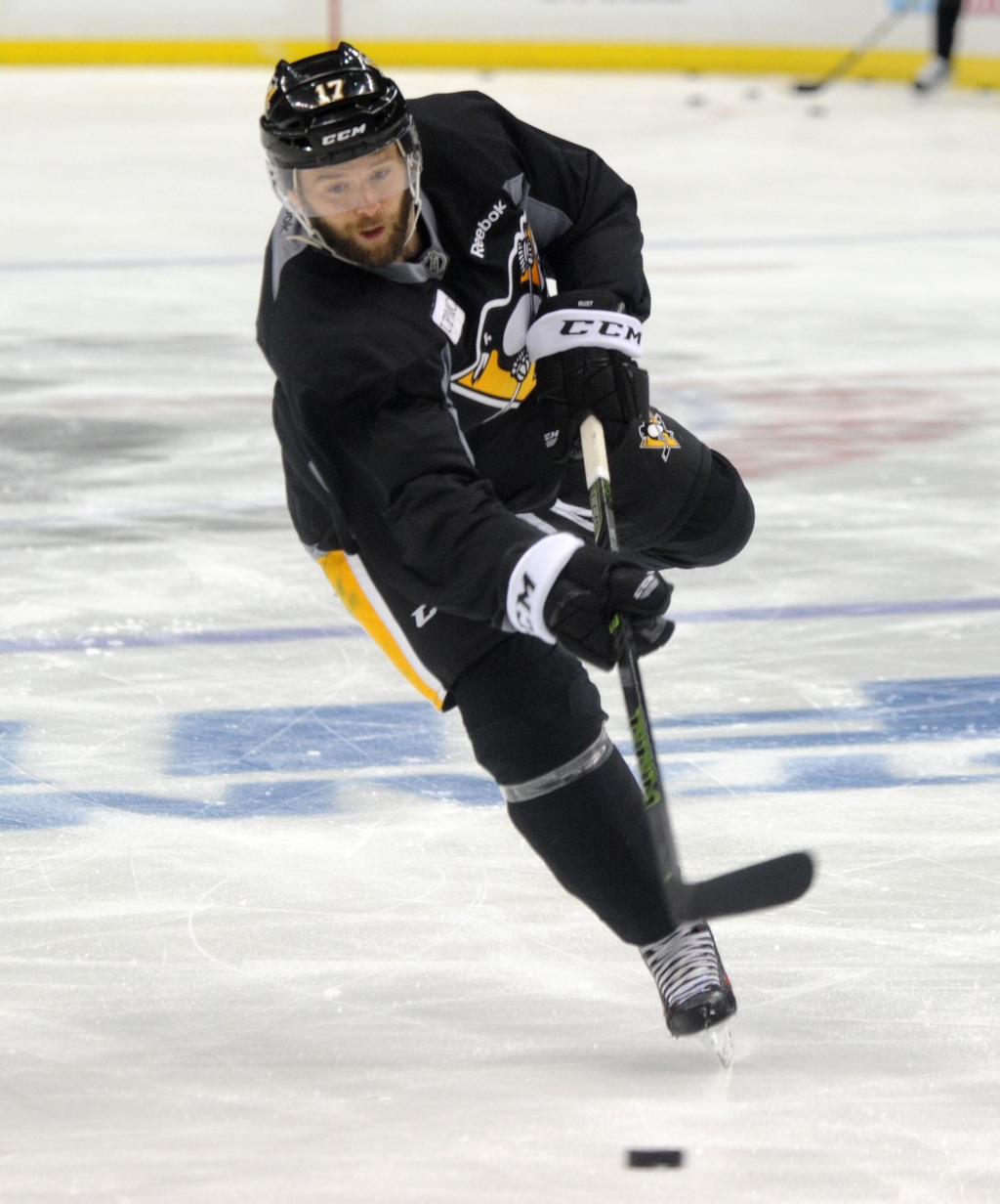 20160601lf-Pens01 The Penguins&#39 Bryan Rust shoots the puck during practice at Consol Energy Center today. Coach Mike Sullivan says playing Rust will be a'game-time decision