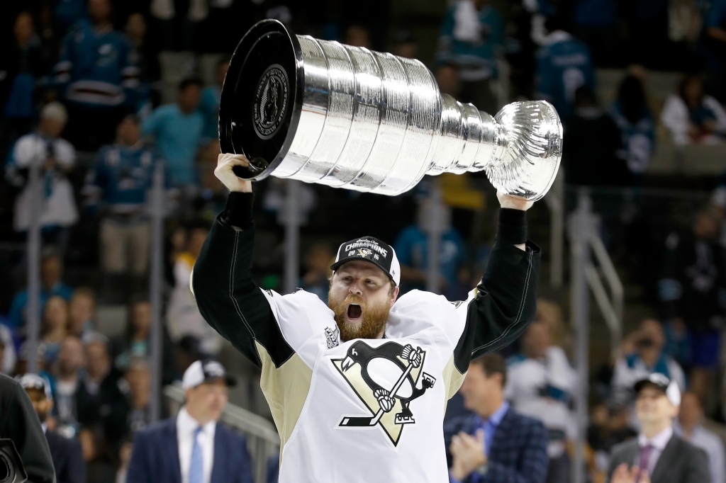 SAN JOSE CA- JUNE 12 Phil Kessel #81 of the Pittsburgh Penguins celebrates with the Stanley Cup after their 3-1 victory to win the Stanley Cup against the San Jose Sharks in Game Six of the 2016 NHL Stanley Cup Final at SAP Center