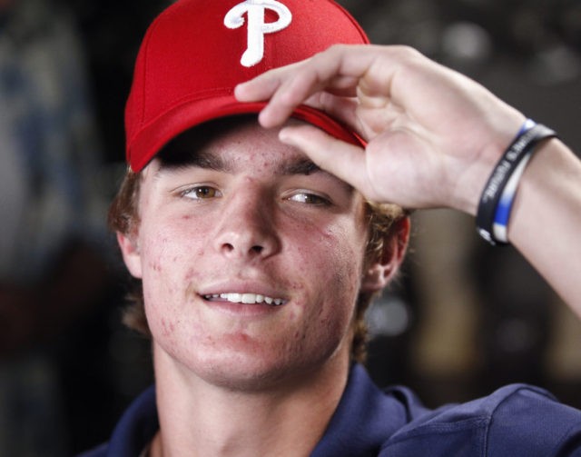 La Costa Canyon baseball player Mickey Moniak puts on a Phillies cap just after it was announced that the Philadelphia Phillies picked him as the number one MLB draft pick