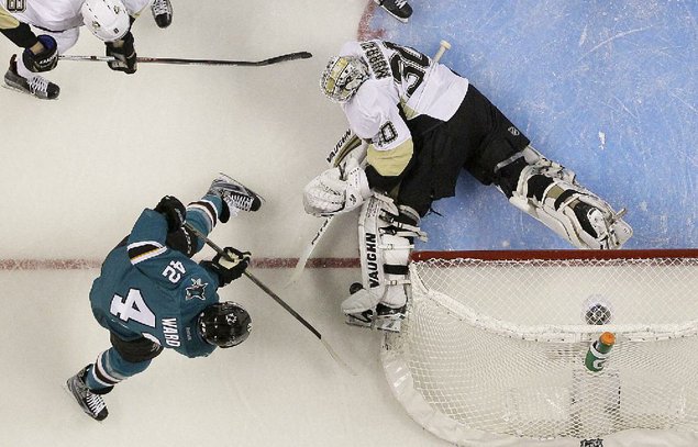 Pittsburgh Penguins goalie Matt Murray defends a shot by San Jose Sharks right wing Joel Ward during the second period of Saturday night’s G