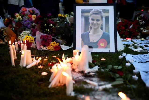 Mourners leave candles in memory of murdered Labour Party MP Jo Cox who was shot dead in Birstall during a vigil at Parliament Square in London Britain