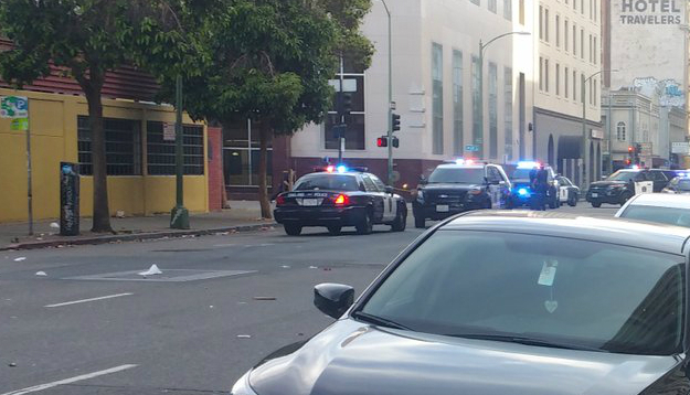 Police gathered at 14th and Franklin streets in Oakland following reports of a shooting