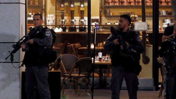 Police officers at the scene of a shooting attack in Tel Aviv