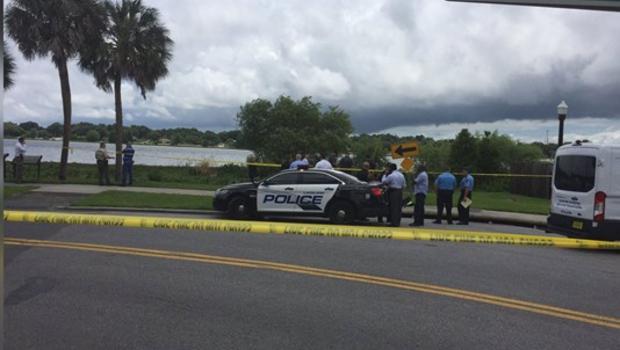 Police were investigating after an alligator was found with a dead body in its mouth on Tuesday