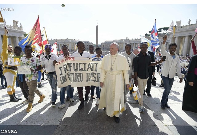 Pope Francis with a group of refugees who accompanied him during his weekly general audience on June 22nd- ANSA