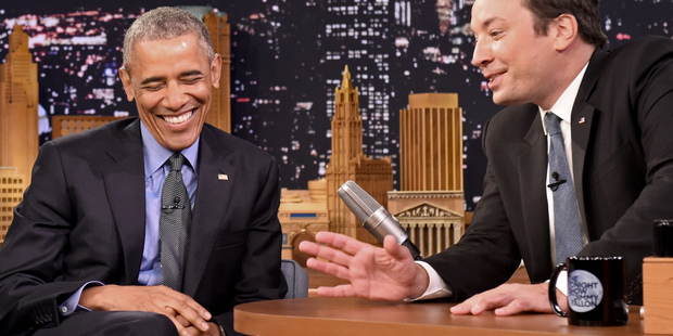 President Barack Obama left laughs while listening to host Jimmy Fallon