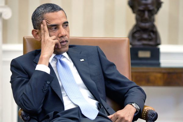 President Barack Obama meets with advisors in the Oval Office of the White House in Washington DC