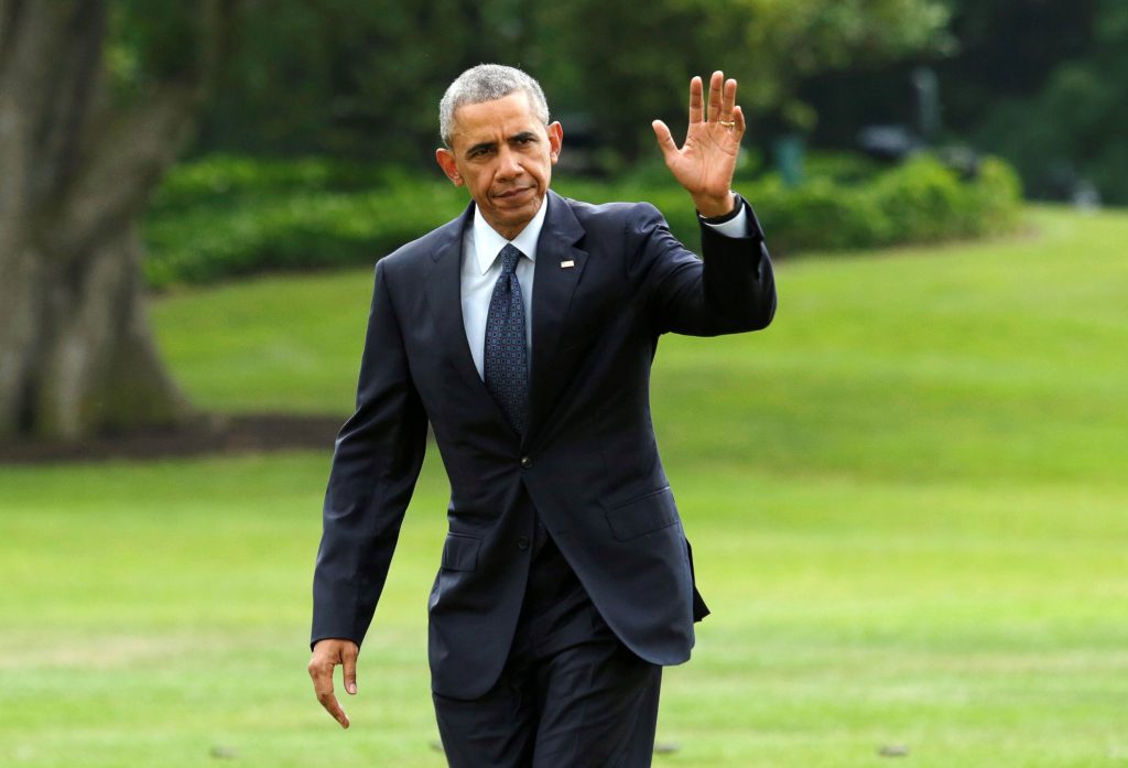 U.S. President Barack Obama waves as he walks on the South Lawn of the White House upon his return to Washington U.S. from Orlando