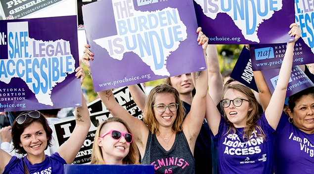 Pro-abortion rights activists wait for rulings in front of the U.S. Supreme Court on Monday in Washington