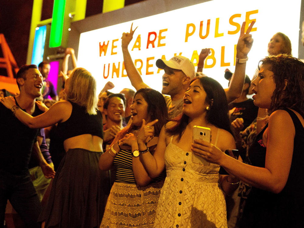 Club goers dance outside Parliament House an LGBT nightclub about a week after the Pulse nightclub mass shooting in Orlando. Pulse's owner has announced a'Latin Night street party for Thursday June 23