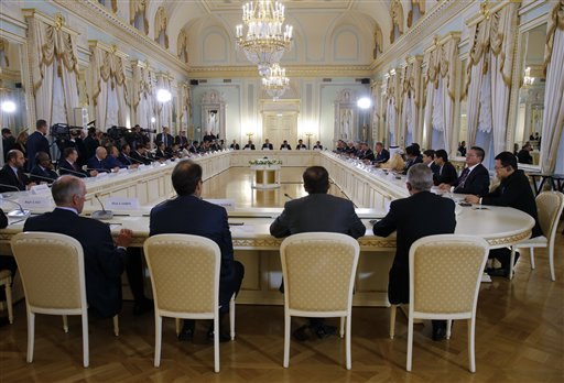 Russian President Vladimir Putin right and Italian Premier Matteo Renzi hold a joint news conference at the St. Petersburg International Economic Forum in St. Petersburg Russia Friday