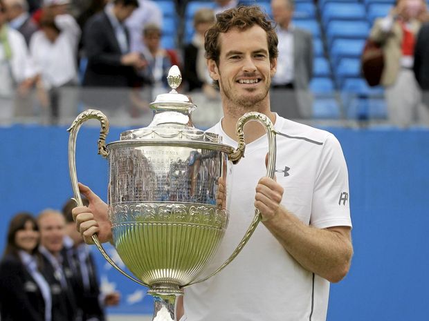 RECORD WIN Britain's Andy Murray lifts the trophy after beating Canada's Milos Raonic in the Queen's Championships final in London