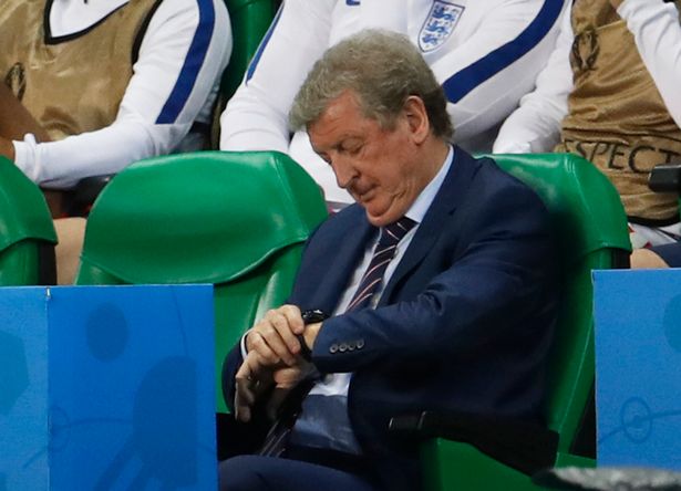 Roy Hodgson checks his watch