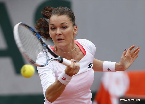 Agnieszka Radwanska of Poland competes during the women's singles fourth round match against Tsvetana Pironkova of Bulgaria at the French Open tennis tournament at Roland Garros in Paris France