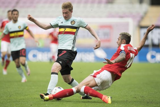 Bruyne left challenges for the ball with Swiss midfielder Valon Behrami right during a friendly soccer match between Switzerland and Belgium at the stade de Geneve stadium in Geneva Switzerland Saturday