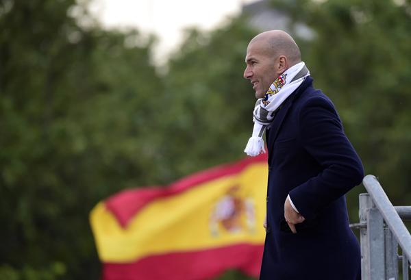 Real Madrid’s French coach Zinedine Zidane celebrates the team’s UEFA Champions League final win on Plaza Cibeles in Madrid on Sunday