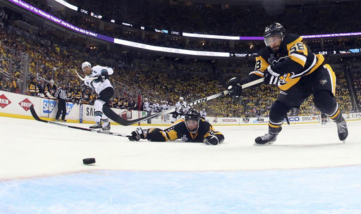 San Jose Sharks&#039 Joe Pavelski scores an empty-net goal past Pittsburgh Penguins&#039 Brian Dumoulin and Kris Letang during the third period in Game 5 of the NHL hockey Stanley Cup Finals on Thursday