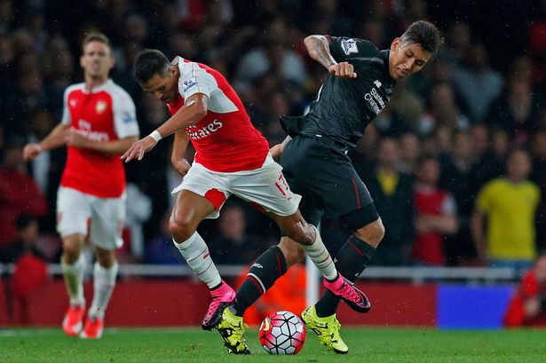 Alexis Sanchez in action with Roberto Firmino