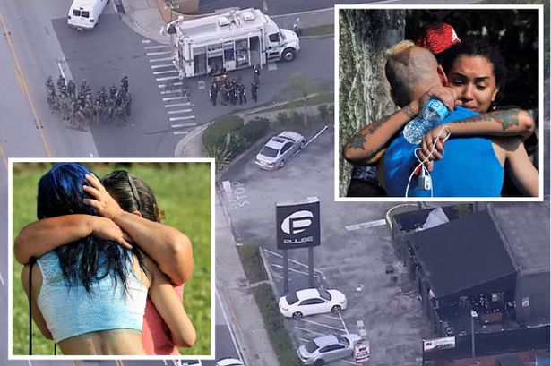 Officers are seen at the Pulse nightclub as survivors comfort each other