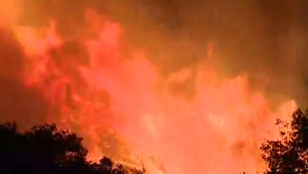 Wildfire near California oil refinery burning out of control