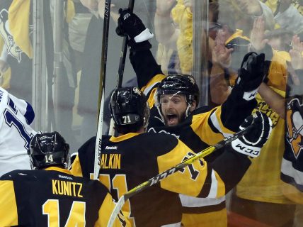 Rookie forward Bryan Rust celebrates with teammates after scoring his second goal of the game. Mandatory Credit Charles LeClaire-USA TODAY Sports