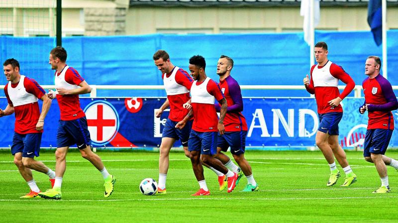 England players warm up during a training session on Friday eve of their match against Russia in Marseille