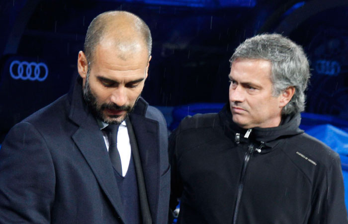 Then Barcelona coach Pep Guardiola greets then Real Madrid coach Jose Mourinho before the start of their Spanish ‘Clasico’ at the Santiago Bernabeu Stadium in Madrid in this Dec. 10 2011 file