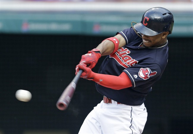 Cleveland Indians Francisco Lindor hits an RBI-single off Kansas City Royals relief pitcher Peter Moylan in the seventh inning of a baseball game Sunday