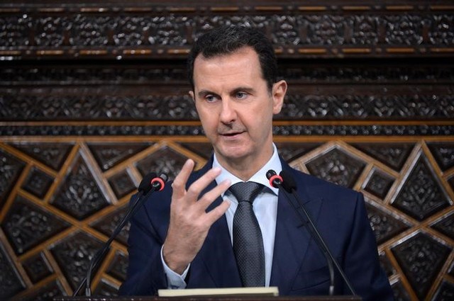 Syria's president Bashar al Assad speaks to Parliament members in Damascus Syria in this handout