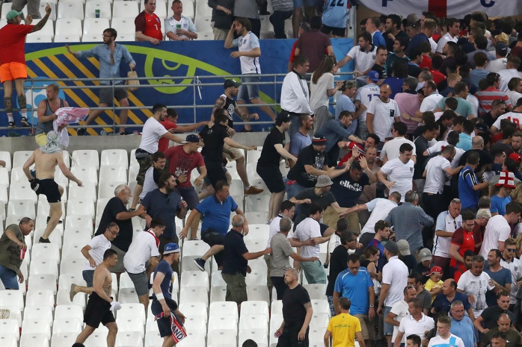 Russian and England fans clash in the stands