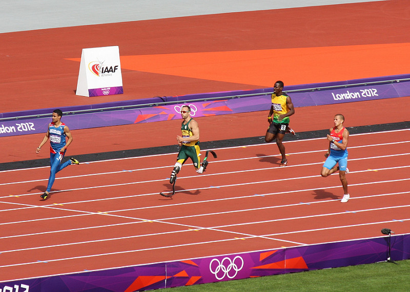 Russian sprinter Maksim Dyldin on the far right trying to catch up to Oscar Pistorius