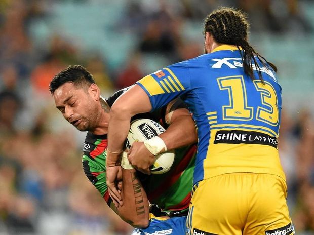 SANDWICHED John Sutton of the Rabbitohs is tackled by Isaac de Gois and Tepai Moeroa of the Eels