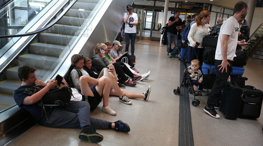 Passengers wait for flight information at the domestic terminal of Arlanda airport in Stockholm Sweden