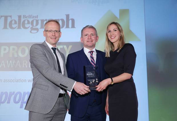 Paul Mc Kenna MD of mac-interiors presents Aine Glackin and Claude Maguire of White Ink Architects with an award for Commercial Architectural Practice of the Year at the Belfast Telegraph Property Award