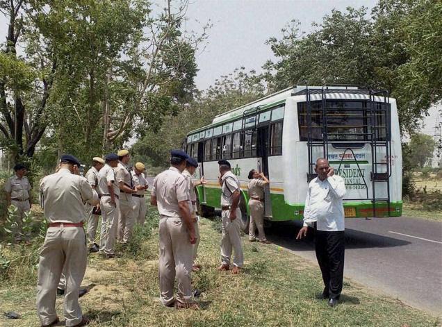 A police team inspects the bus on which a blast took place near Bhuna in Haryana on Tuesday