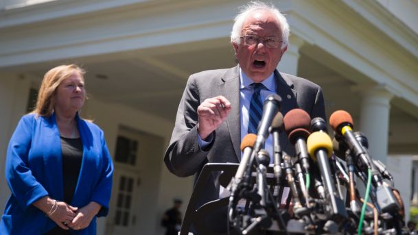 Sen. Bernie Sanders accompanied by his wife Jane Sanders speaks to reporters outside the White House Washington U.S