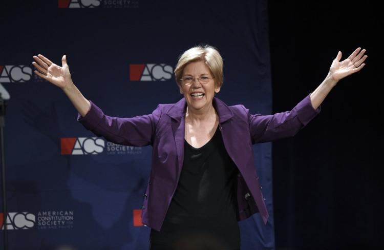 Sen. Elizabeth Warren gestures to the crowd after speaking at a convention in Washington D.C