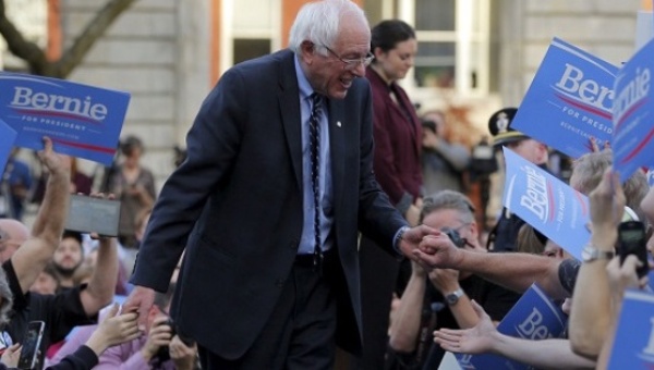 Senator Bernie Sanders greets supporters at a campaign rally outside the New Hampshire State House on Nov. 5 2015