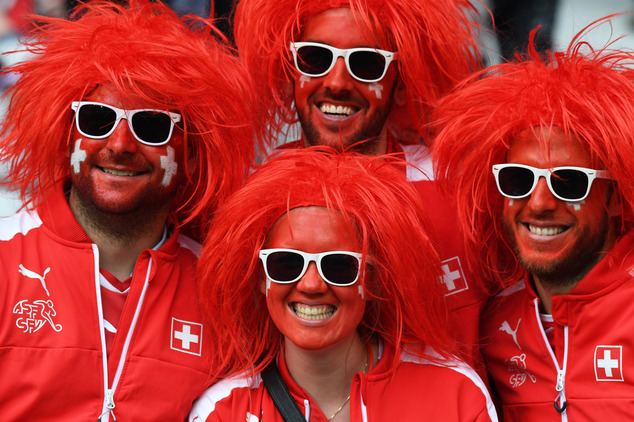 Switzerland supporters pose on the stands before the Euro 2016 Group A soccer match between Switzerland and France at the Pierre Mauroy stadium in Villeneuve